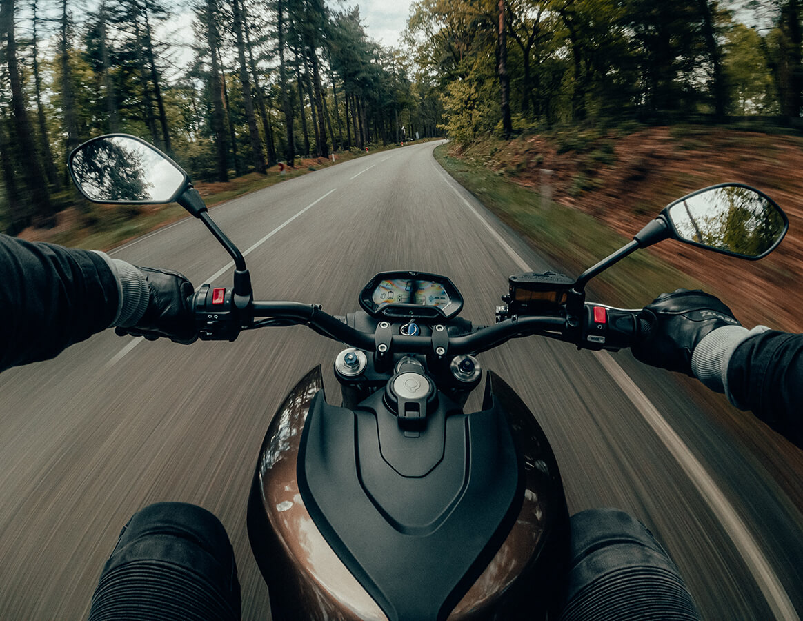 First-person perspective of a person riding a motorcycle 