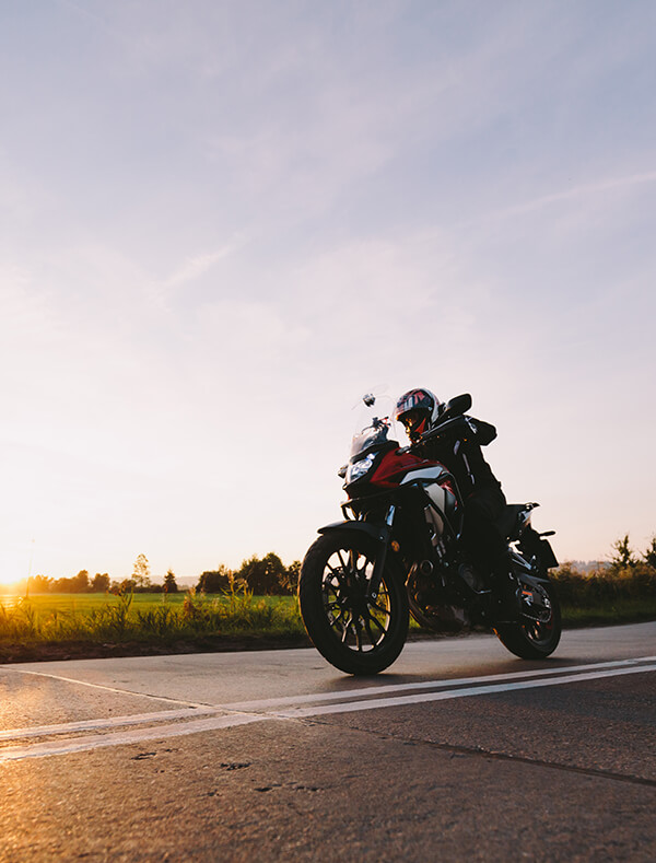 Person riding a motorcycle on the highway 