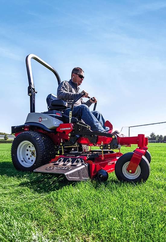 Man on an Exmark mower