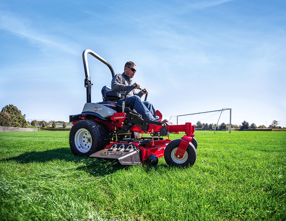 Man riding Exmark mower 